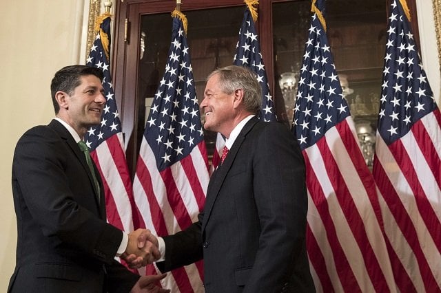 in this file photo taken on june 25 2017 l to r speaker of the house paul ryan shakes hands with representative elect ralph norman r sc during in a ceremonial swearing in on capitol hill in washington dc a us congressman said he pulled out a loaded smith amp wesson pistol during a meeting with gun control activists on april 6 2018 in a bid to prove that firearms are not responsible for violence photo afp