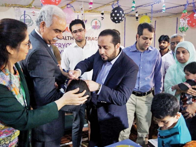 provincial minister for primary and secondary healthcare khawaja imran nazir gives a child polio drops at mian mir hospital photo nni provincial minister for primary and secondary healthcare khawaja imran nazir gives a child polio drops at mian mir hospital photo nni