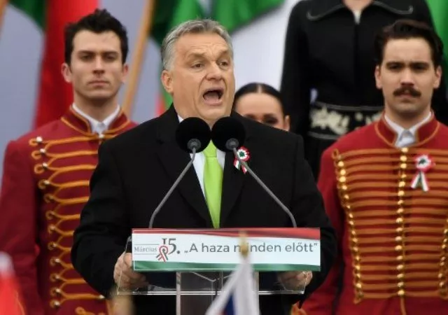 hungarian prime minister viktor orban delivers a speech in front of the building of the hungarian parliament in budapest on march 15 2018 during the official commemoration of the 170th anniversary of the 1848 1849 hungarian revolution tens of thousands of hungarians took to the streets thursday in separate national day demonstrations to both voice support for and protest against prime minister viktor orban as an election april 8 nears photo afp