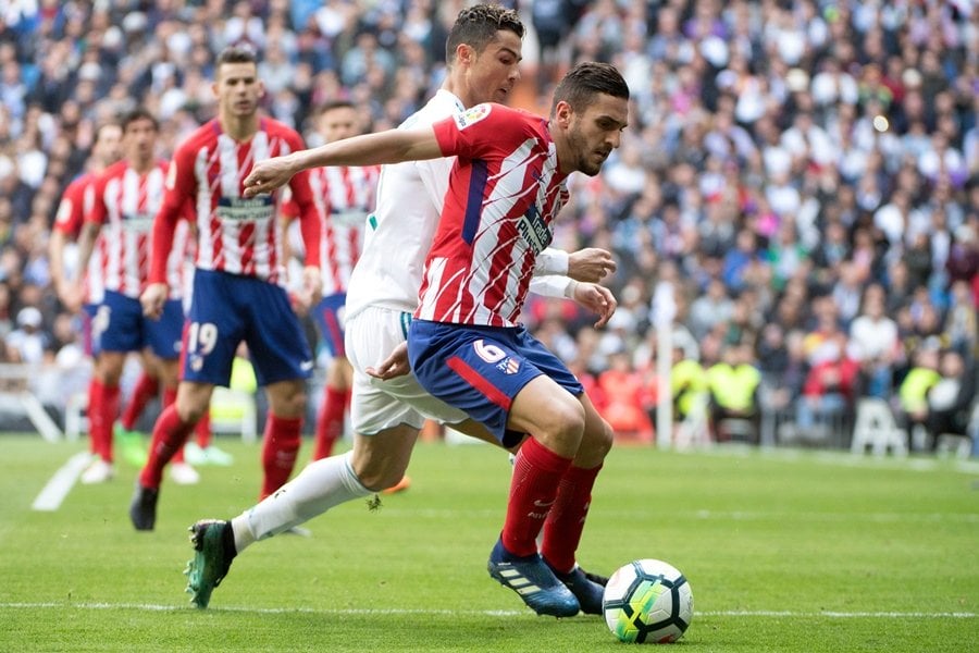 real madrid 039 s portuguese forward cristiano ronaldo l challenges atletico madrid 039 s spanish midfielder koke during the spanish league football match between real madrid cf and club atletico de madrid at the santiago bernabeu stadium in madrid on april 8 2018 photo afp