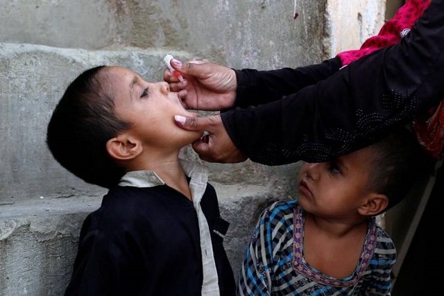 a boy receives polio vaccine drops during an anti polio campaign in a low income neighbourhood in karachi pakistan april 9 2018 photo reuters
