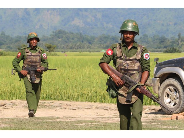 tatmadaw soldiers patrol a village in maungdaw on october 21 2016 photo afp