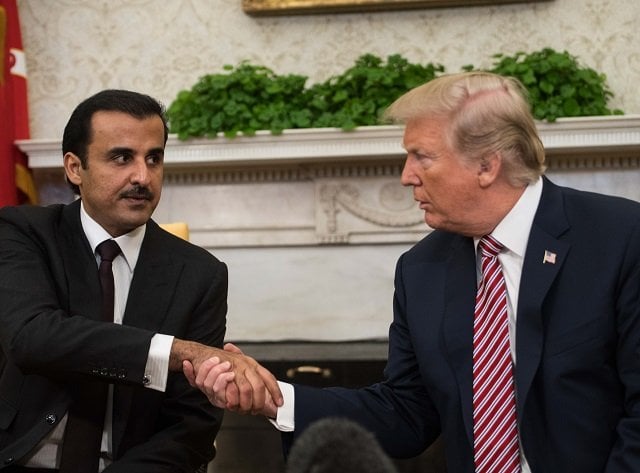 us president donald trump shakes hands with the emir of qatar sheikh tamim bin hamad al thani in the oval office at the white house in washington dc on april 10 2018 photo afp