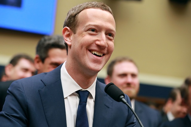 facebook co founder chairman and ceo mark zuckerberg smiles at the conclusion of his testimony before the house energy and commerce committee in the rayburn house office building on capitol hill april 11 2018 in washington dc photo afp