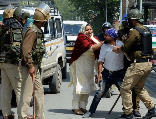 indian security personnel detain a kashmiri man during protests by students in srinagar on april 11 2018 photo afp indian security personnel detain a kashmiri man during protests by students in srinagar on april 11 2018 photo afp
