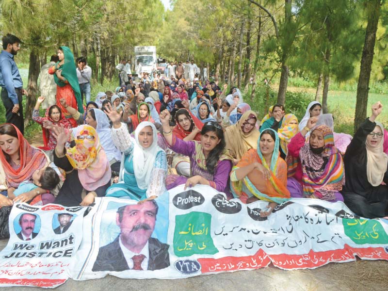 staff of fde employed on daily wages stage a sit in in front of cadd minister tariq fazal chaudhry photo express