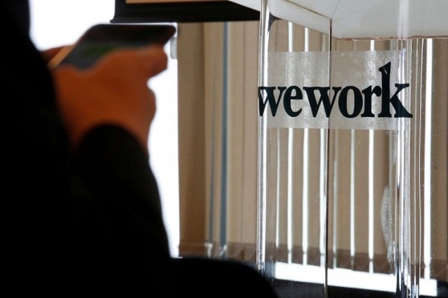 a guest attends the opening ceremony of wework hong kong flagship location in hong kong china february 23 2017 photo reuters