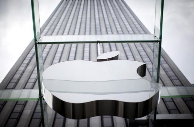 an apple logo hangs above the entrance to the apple store on 5th avenue in the manhattan borough of new york city july 21 2015 photo reuters