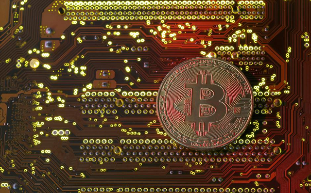 a copy of bitcoin standing on pc motherboard is seen in this illustration picture october 26 2017 photo reuters