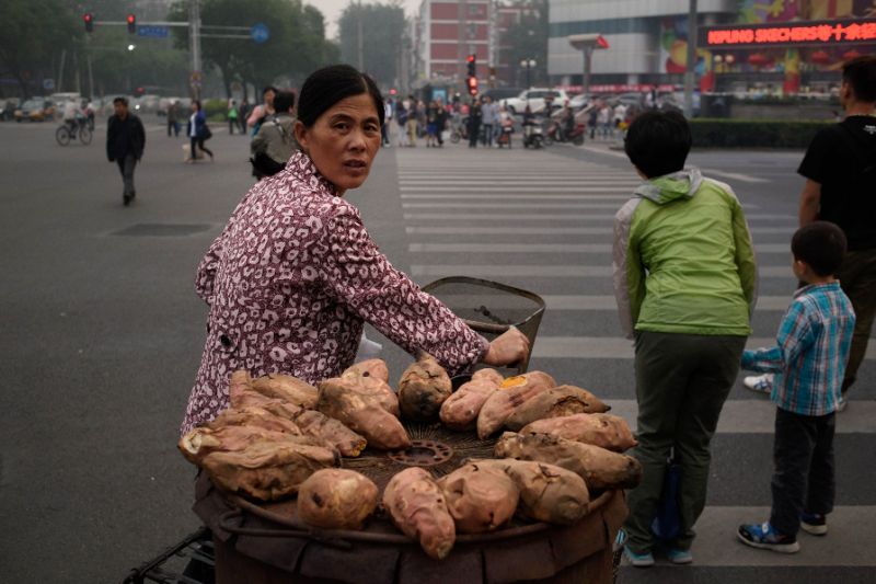 how sweet potatos seen here hauled by a street vendor in bejing spread from south america to polynesia centuries ago is the subject of a new study that concludes that wind borne seeds is the likely explanation photo afp