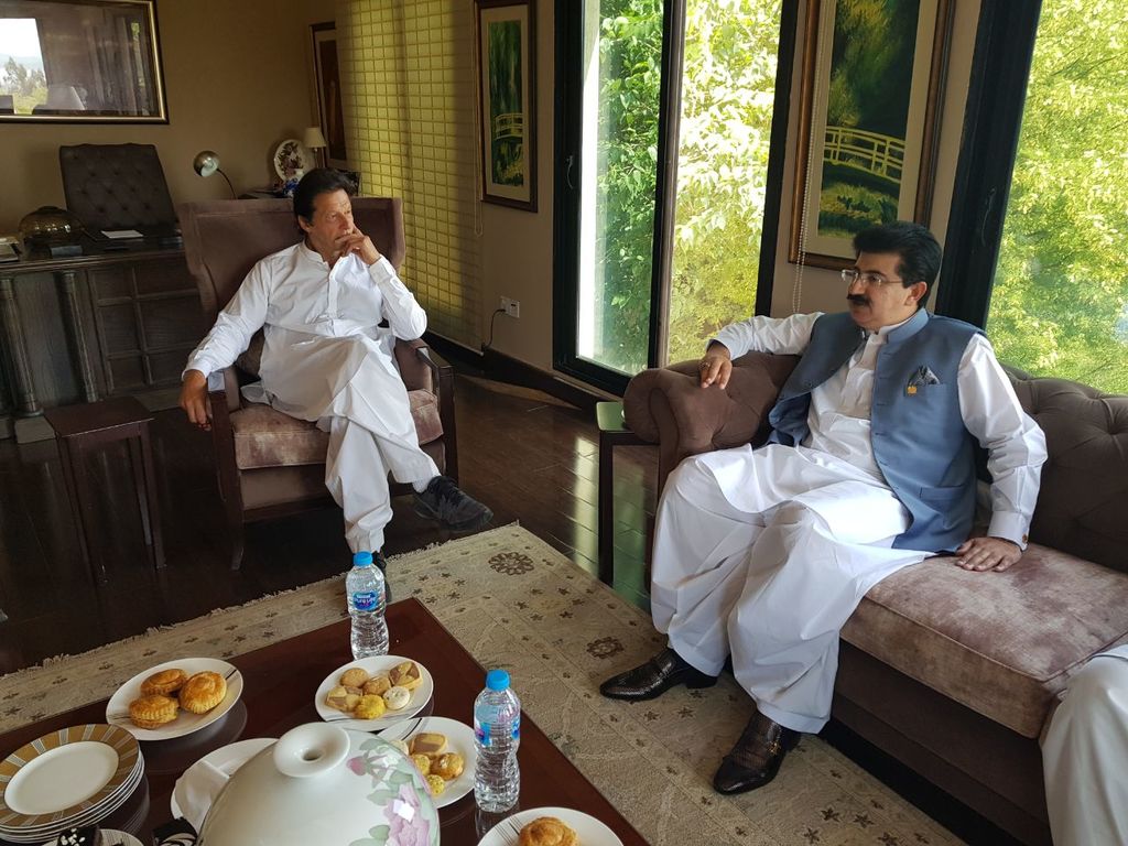 pti chief imran khan with senate chairperson sadiq sanjrani photo express