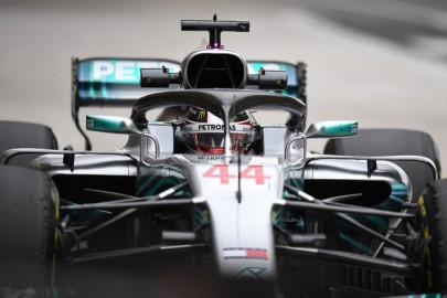 hamilton races to top past ferrari