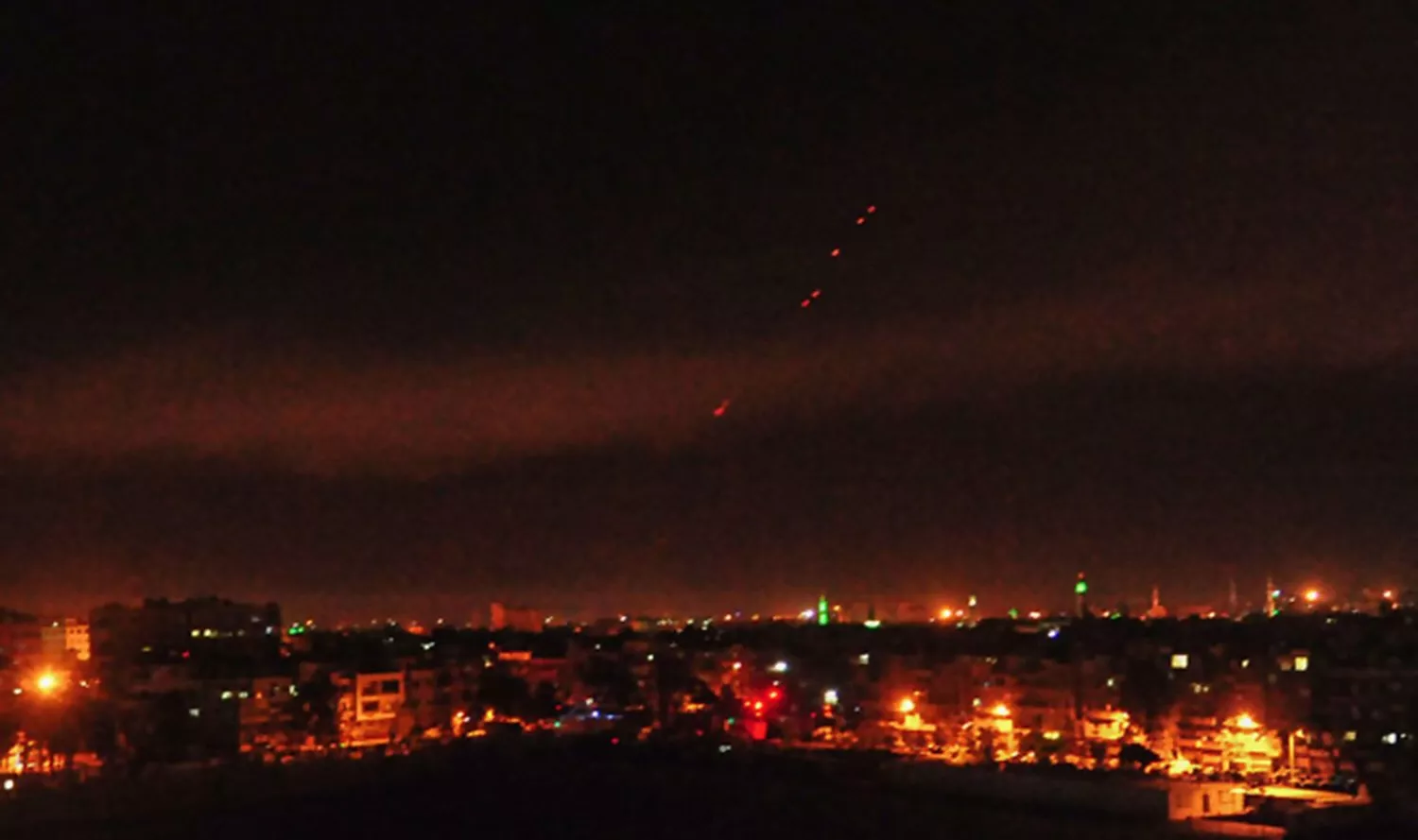 a photo released on the twitter page of the syrian government 039 s central military media shows anti aircraft fire on the outskirts of damascus after western strikes reportedly hit syrian military bases and chemical research centres in and around the capital photo afp