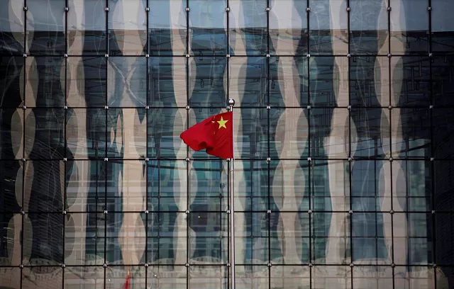a chinese national flag flutters at the headquarters of a commercial bank on a financial street in central beijing china november 24 2014 photo reuters a chinese national flag flutters at the headquarters of a commercial bank on a financial street in central beijing china november 24 2014 photo reuters