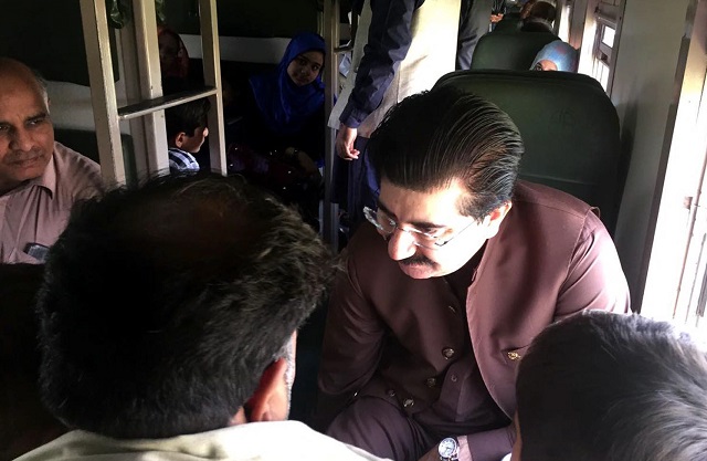 senate chairman sadiq sanjrani interacting with fellow commuters in a train on sunday photo inp