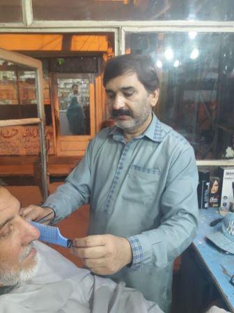 ghulam ali the deaf and mute barber in his shop in rawalpindi