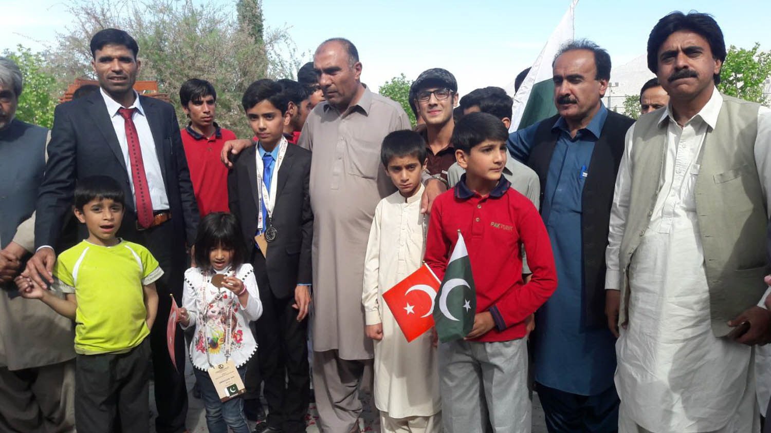 yasir jan notezai who secured second position at the international climate olympiad in kenya is seen with his father provincial minister amanullah notezai and others in quetta photo express