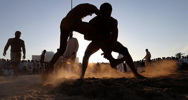 the winner is declared when a fighter manages to pin his opponent to the ground on his back photo afp the winner is declared when a fighter manages to pin his opponent to the ground on his back photo afp
