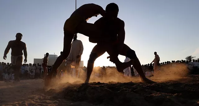 the winner is declared when a fighter manages to pin his opponent to the ground on his back photo afp the winner is declared when a fighter manages to pin his opponent to the ground on his back photo afp