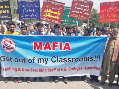 students teachers and staff protest against illegal occupation of college