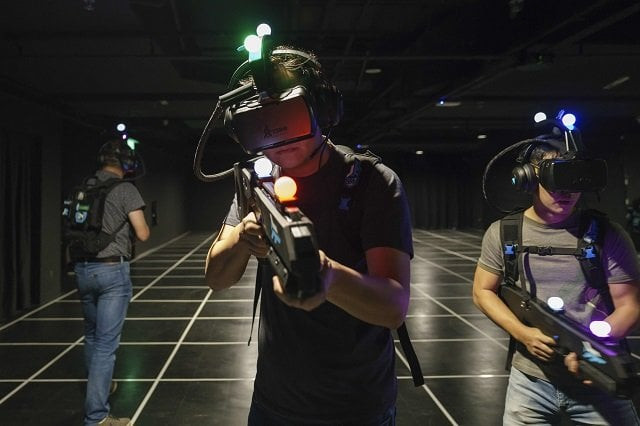 this photograph taken on march 6 2018 shows a group of gamers wearing virtual reality headsets at zero latency singapore in singapore gamers wearing headsets and wielding rifles adorned with flashing lights battle a horde of zombies letting out the occasional terrified shriek the virtual reality arcade in singapore is the latest to pop up around the world as backers of the technology seek to shake off teething problems and break into the mainstream photo afp this photograph taken on march 6 2018 shows a group of gamers wearing virtual reality headsets at zero latency singapore in singapore gamers wearing headsets and wielding rifles adorned with flashing lights battle a horde of zombies letting out the occasional terrified shriek the virtual reality arcade in singapore is the latest to pop up around the world as backers of the technology seek to shake off teething problems and break into the mainstream photo afp