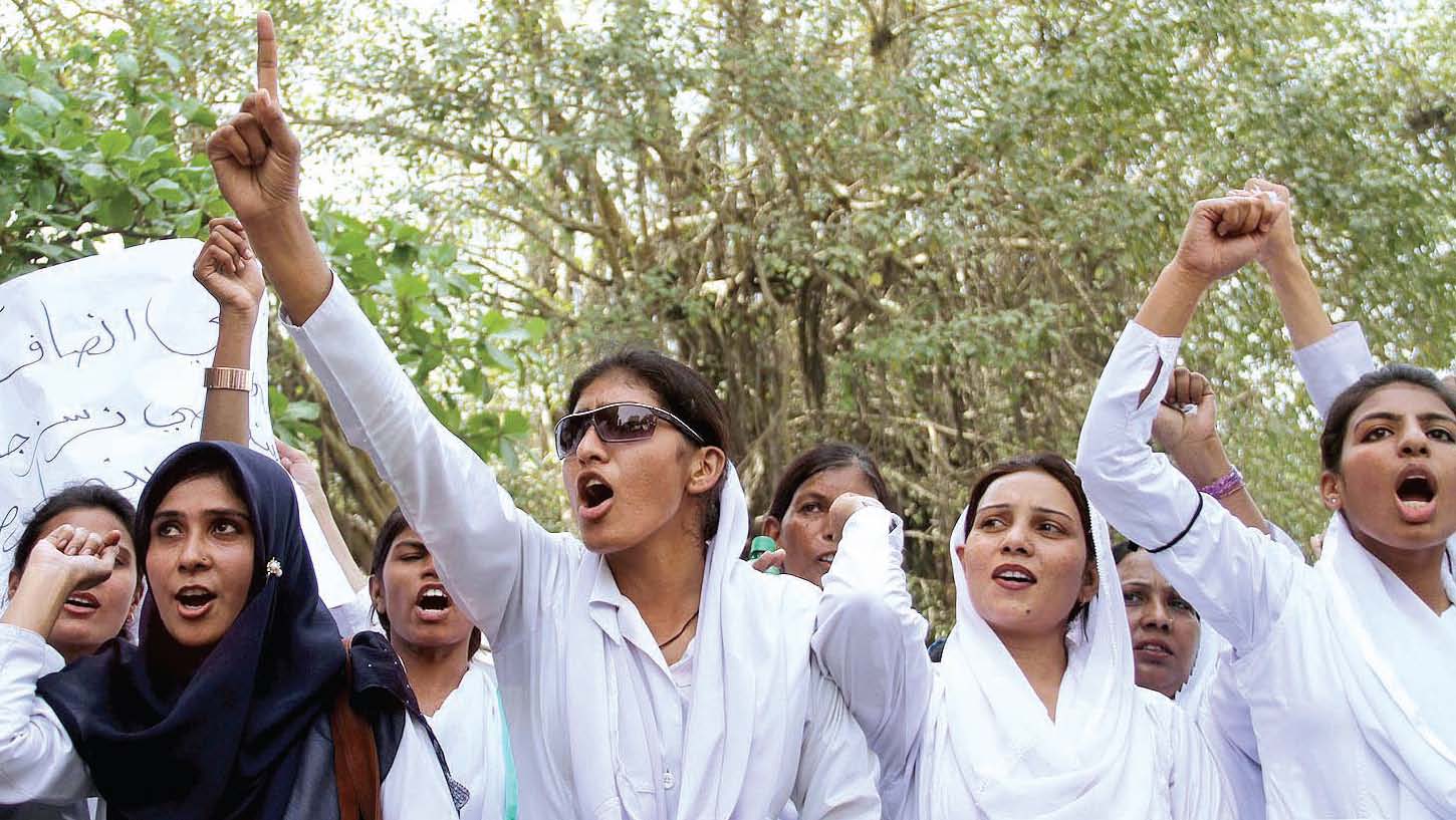 nurses paramedics and doctors at government run hospitals across the province boycotted their work ranging from one hour to six hours on monday and called upon the government to accept their demands above activists of the pakistan nursing association raise slogans outside the karachi press club photo inp