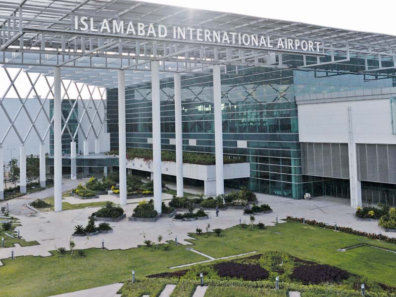 a worker cleans floor at the newly built islamabad international airport photo afp