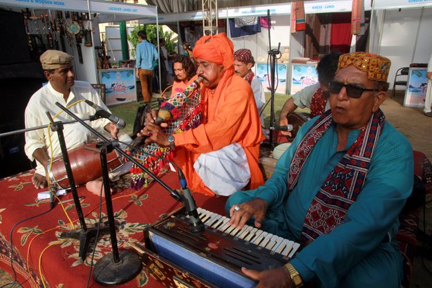 the sea festival attracted hundreds of people who thoroughly enjoyed the folk music being played at the event photo athar khan