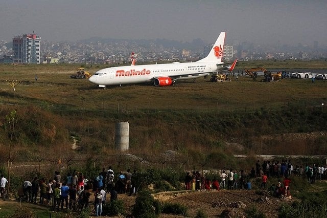 people gather near an aircraft belonging to malindo air that skidded off the runway during take off last night at tribhuvan international airport in kathmandu nepal april 20 2018 photo reuters people gather near an aircraft belonging to malindo air that skidded off the runway during take off last night at tribhuvan international airport in kathmandu nepal april 20 2018 photo reuters