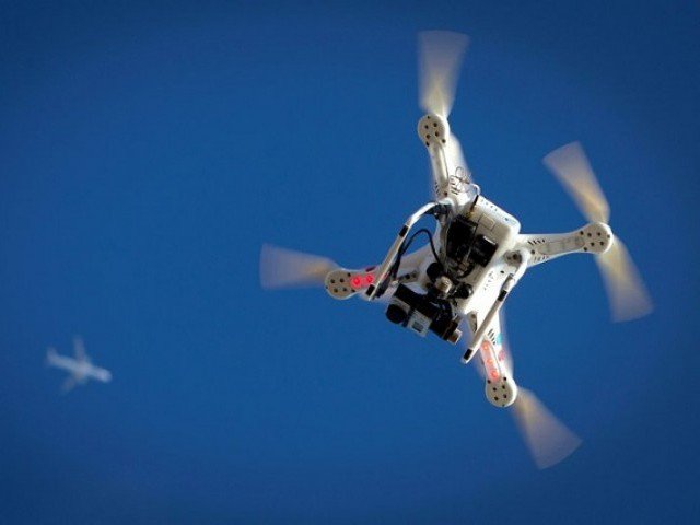 an airplane flies over a drone during the polar bear plunge on coney island in the brooklyn borough of new york us january 1 2015 photo reuters