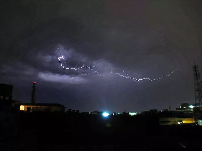 lightning strikes in peshawar while a woman treads through snow in chitral photo agencies lightning strikes in peshawar while a woman treads through snow in chitral photo agencies