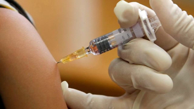 a doctor vaccinates a patient in a municipal vaccination centre photo reuters a doctor vaccinates a patient in a municipal vaccination centre photo reuters