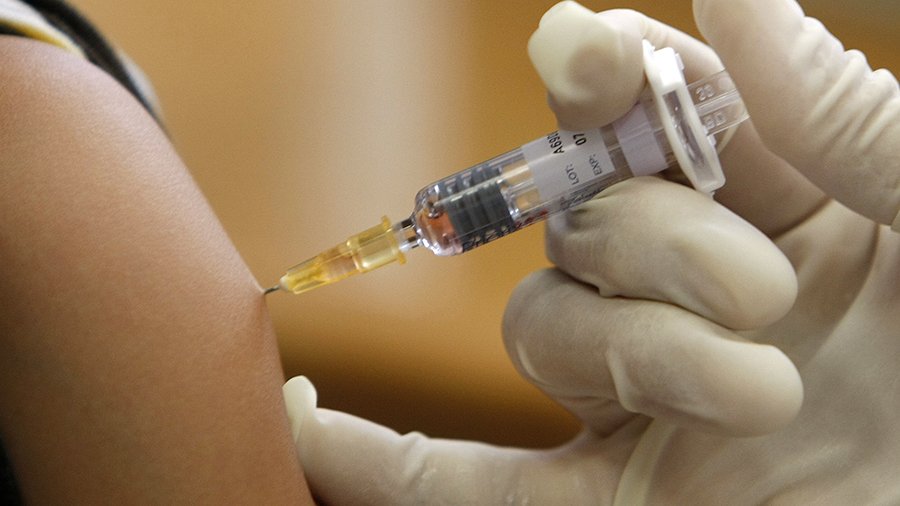 a doctor vaccinates a patient in a municipal vaccination centre photo reuters