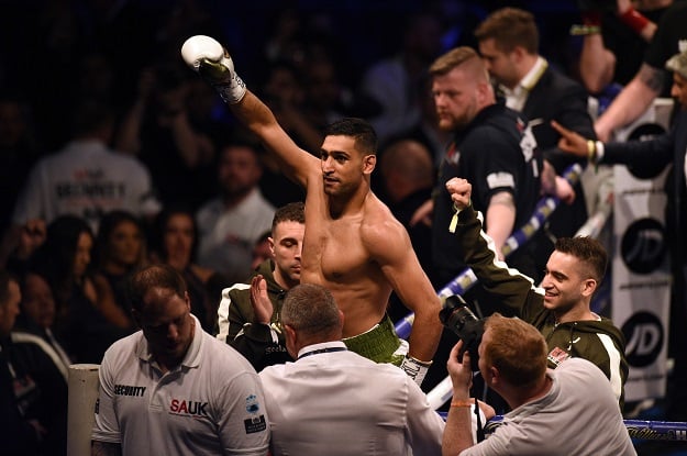 amir khan celebrates defeating canada 039 s phil lo greco in their super welterweight contest at the echo arena in liverpool northern england on april 21 2018 photo afp