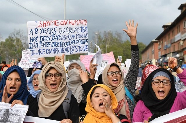 in this file photo taken on april 16 2018 students of the all ladakh association of kashmir hold placards and shout slogans in srinagar during a protest calling for justice following the recent rape and murder case of an eight year old girl in kashmir photo afp