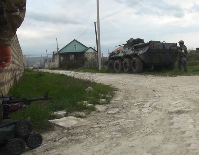 russian security officers work at the scene of a counter terrorism operation in the republic of dagestan russia on april 21 2018 photo russian national anti terrorism committee