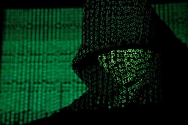 a projection of cyber code on a hooded man is pictured in this illustration picture taken on may 13 2017 photo reuters a projection of cyber code on a hooded man is pictured in this illustration picture taken on may 13 2017 photo reuters