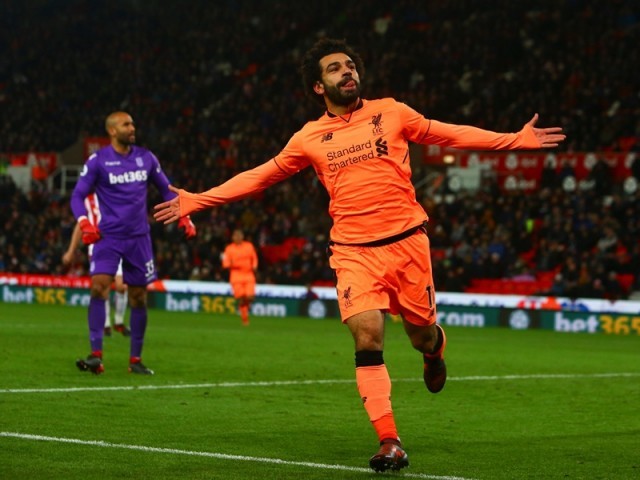 liverpool 039 s egyptian midfielder mohamed salah celebrates scoring their third goal during the english premier league football match between stoke city and liverpool at the bet365 stadium in stoke on trent central england photo afp