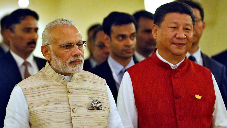 indian prime minister narendra modi and chinese president xi jinping arrive for a photo opportunity ahead of brics brazil russia india china and south africa summit in benaulim photo reuters