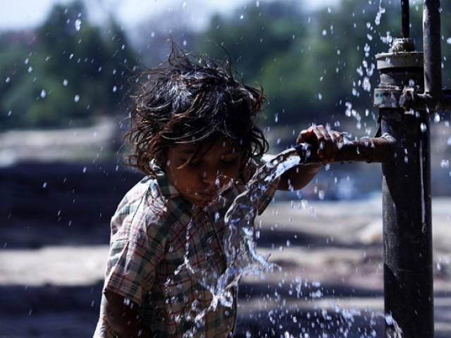 a girl drinking water from a hand pump on the eve of world water day photo online a girl drinking water from a hand pump on the eve of world water day photo online