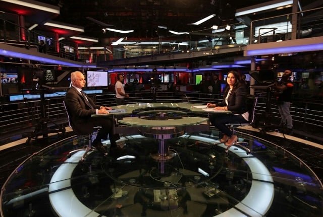 a candidate of lebanon 039 s future movement is interviewed on television ahead of may 6 parliamentary election photo afp