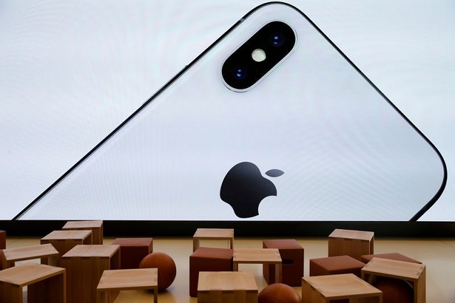 an iphone x is seen on a large video screen in the apple visitor centre in cupertino california us november 17 2017 photo reuters