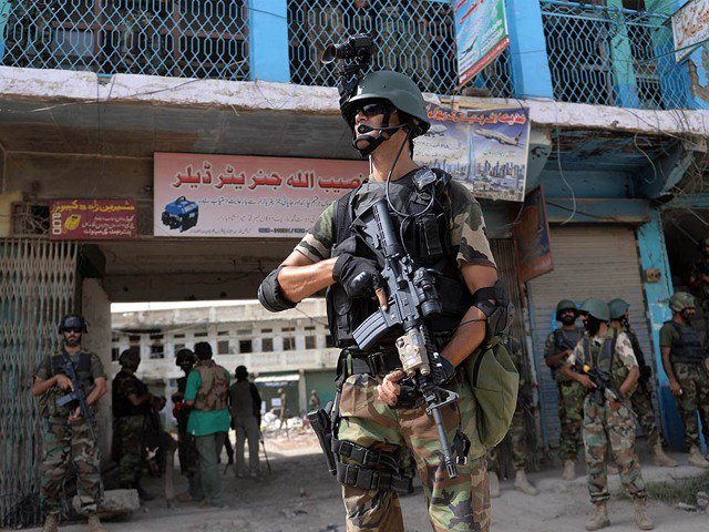 soldiers patrol at an empty bazaar during a military operation against taliban militants in the main town of miramshah in north waziristan on july 9 2014 photo afp
