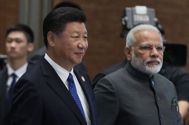 chinese president xi jinping and indian prime minister narendra modi pictured at the 2017 brics summit in xiamen will meet again friday for an quot informal summit quot in the central chinese city of wuhan photo afp