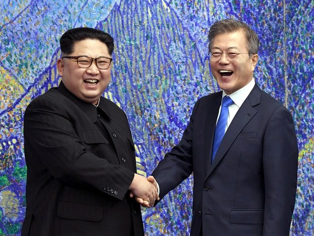 south korea 039 s president moon jae in r shakes hands with north korea 039 s leader kim jong un l during the inter korean summit in the peace house building on the southern side of the truce village of panmunjom on april 27 2018 north korean leader kim jong un and the south 039 s president moon jae in sat down to a historic summit on april 27 after shaking hands over the military demarcation line that divides their countries in a gesture laden with symbolism photo afp