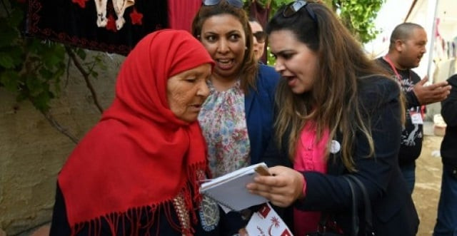 ines boussetta r who heads the list of the nidaa tounes party for municipal elections in tebourba campaigns in the town some 35 kilometres west of the capital on april 20 2018 photo afp ines boussetta r who heads the list of the nidaa tounes party for municipal elections in tebourba campaigns in the town some 35 kilometres west of the capital on april 20 2018 photo afp