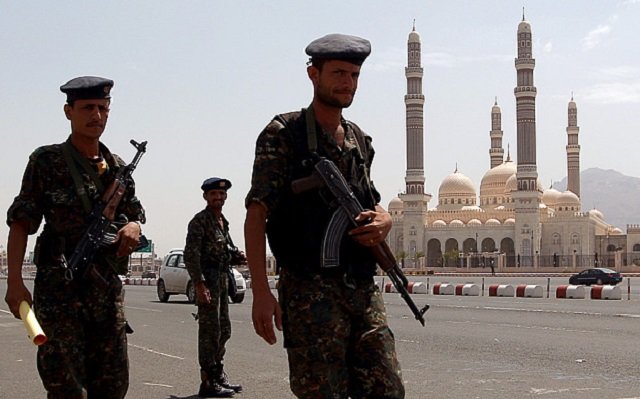 file photo of yemeni security forces patrolling past the al saleh mosque in the capital sanaa photo afp file