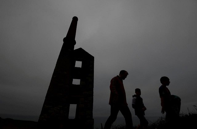 file photo a family walk past the remains of the engine house at the wheal prosper copper and tin mine on the cornish coastline near porthleven in cornwall britain october 26 2017 photo reuters