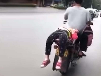 novel parenting man ties school reluctant daughter to back of motorcycle