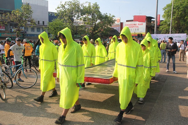 thai demonstrators dressed in green outfit rally in chiang mai on april 29 2018 to protest against the construction of government housing project for judges and court officials on the forested land flanking a revered mountain in one of the largest shows of dissent under junta rule photo afp